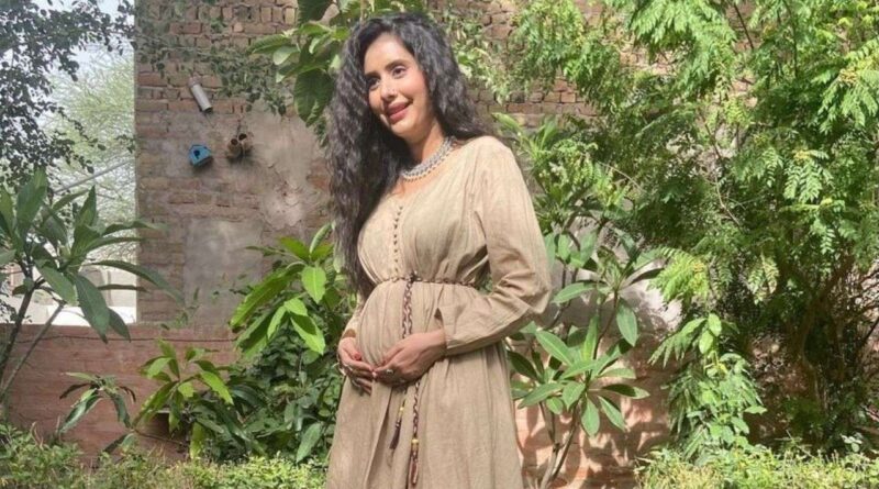 Sushmita Sen's sister-in-law Charu Asopa is seen flaunting her baby bump in maternity photoshoot.